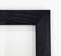 a close-up view of a black wooden frame with a dark finish, set against a white background.